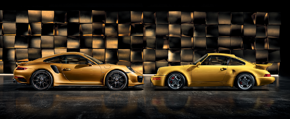 Porsche 911 Turbo S Exclusive Series parked next to a vintage Porsche 911 Turbo