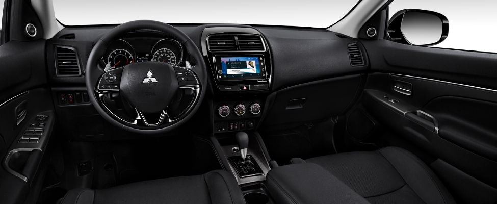 The interior of the Mitsubishi RVR featuring a touch-screen infotainment system
