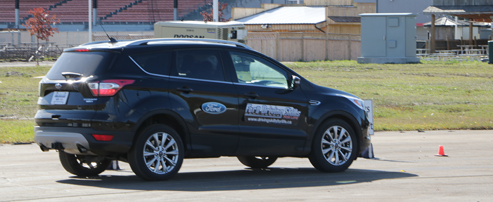 A Ford Escape navigating the hazard recognition driving course.