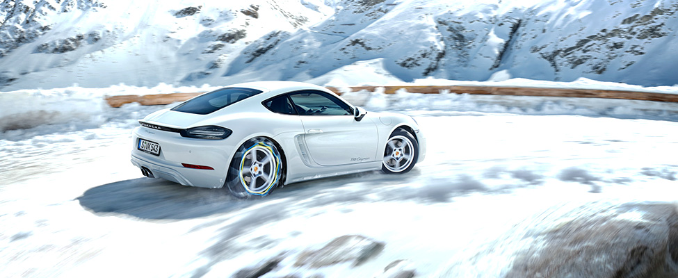 Porsche 718 on snowy road