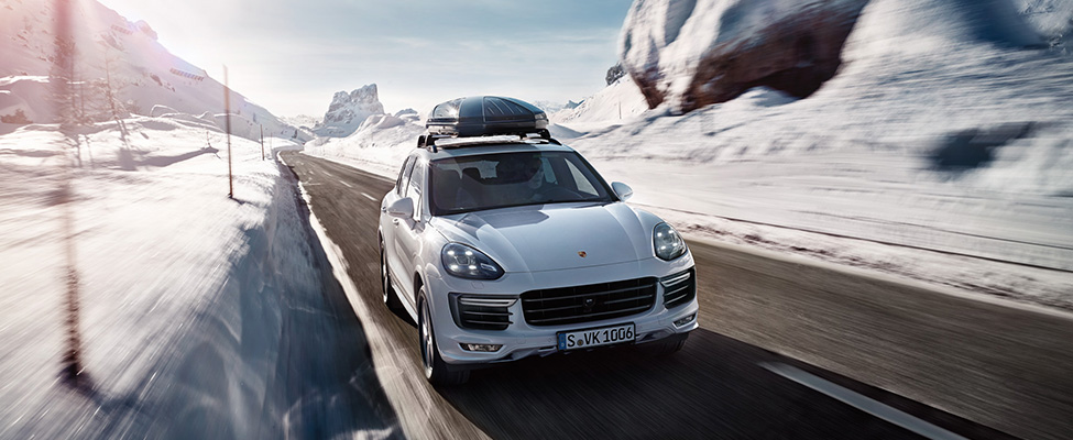 Porsche Cayenne on snowy road 