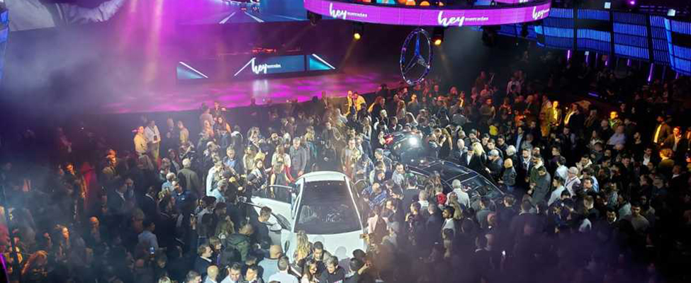 The Mercedes-Benz A-Class surrounded by young people at a club.
